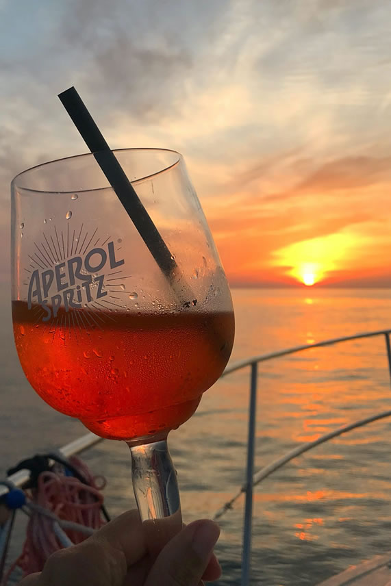 Aperitif at sunset on the boat