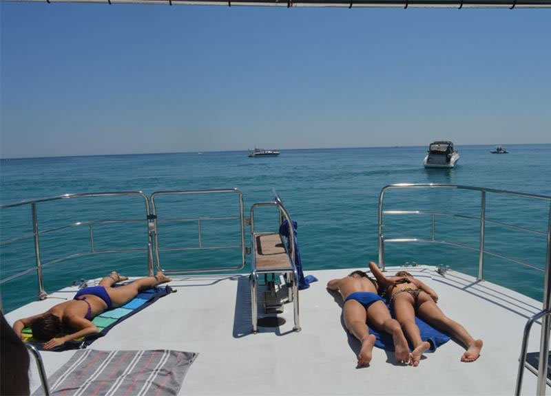 Sunbathing on a Catamaran